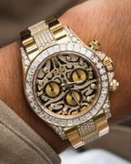 Gold wristwatch with diamond accents on a wrist