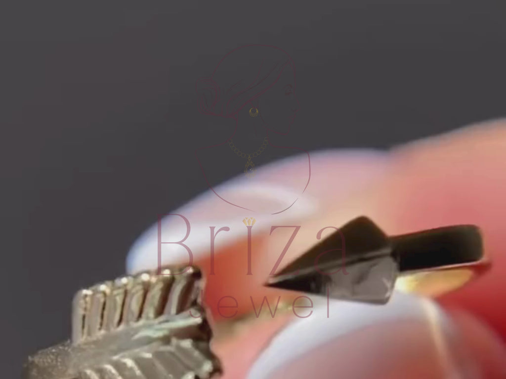 simplistic engagement ring close-up showing arrow-style detail