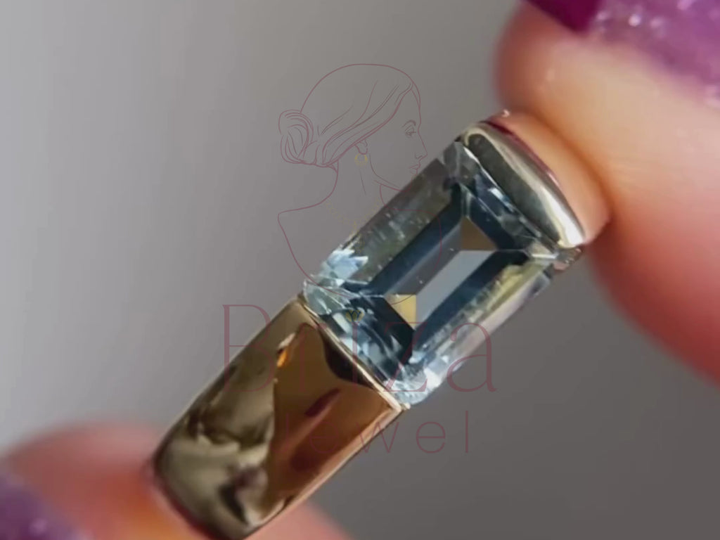 lab grown emerald cut diamond close-up showing blue moissanite detail