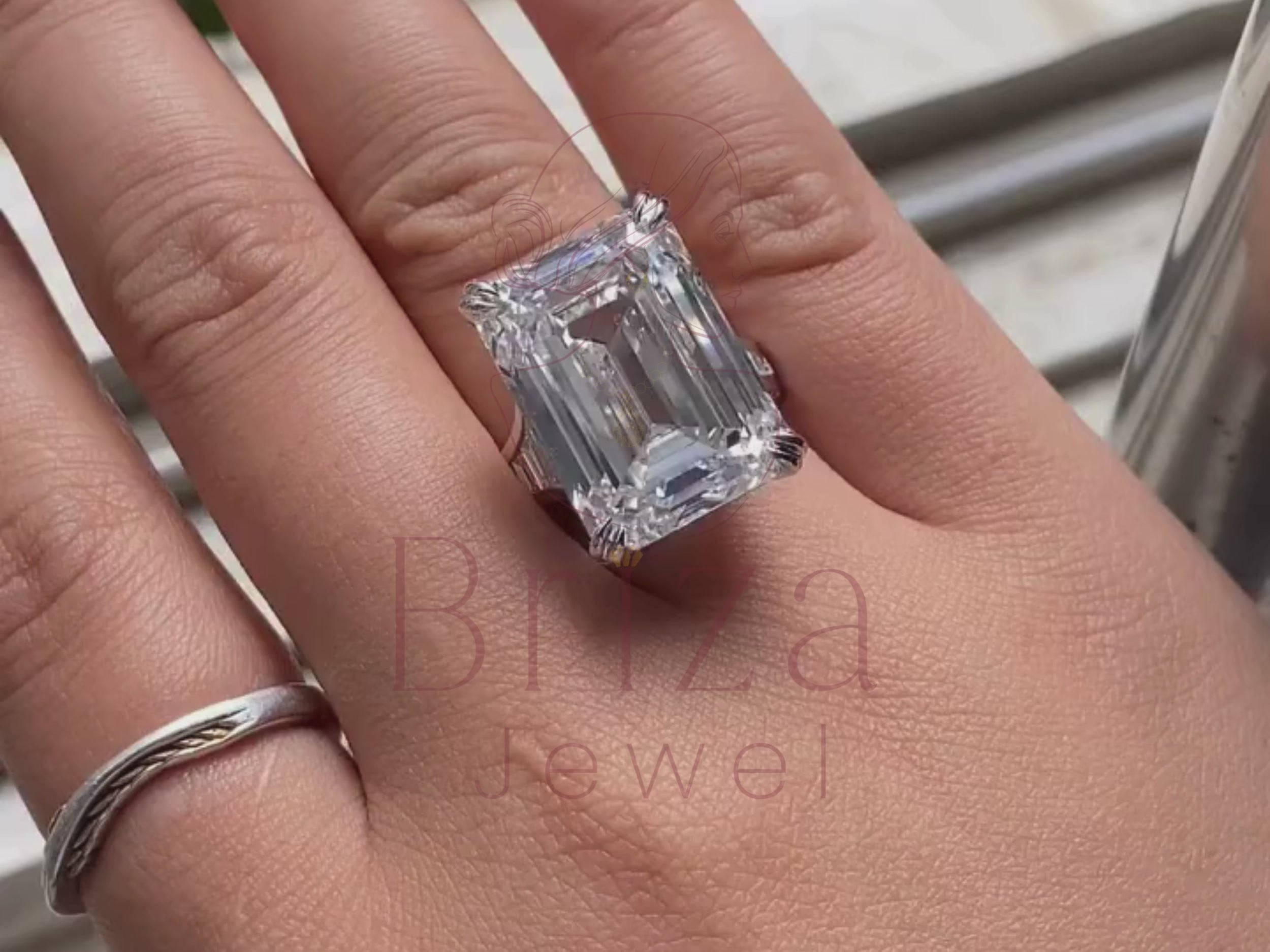 emerald cut moissanite ring close-up showing baguette details