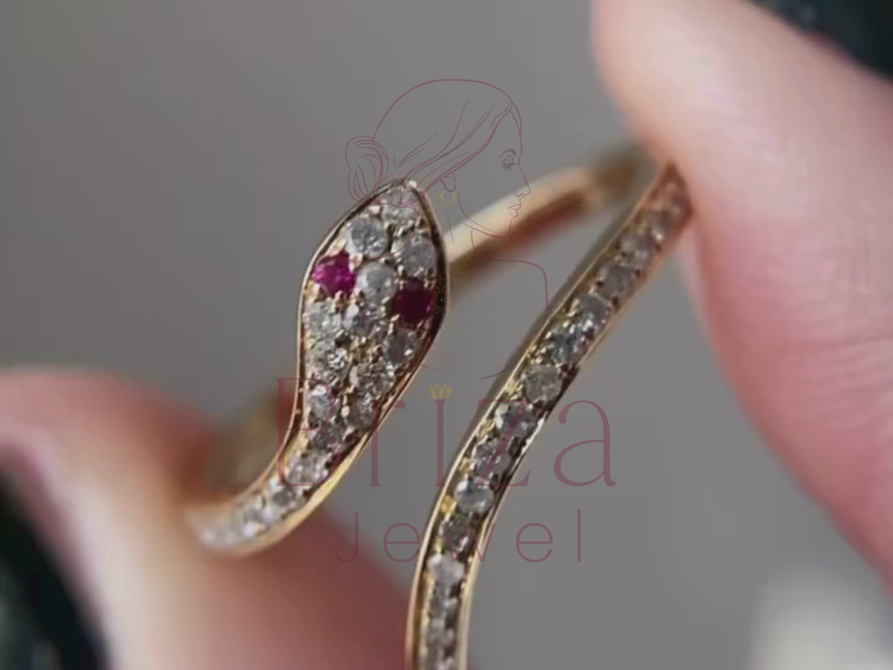 Bulgari snake ring close-up showing ruby eye details