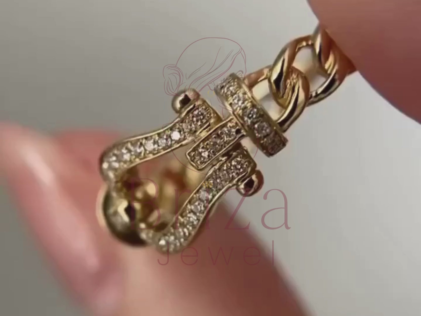 yellow gold engagement band close-up showing pavé buckle detail