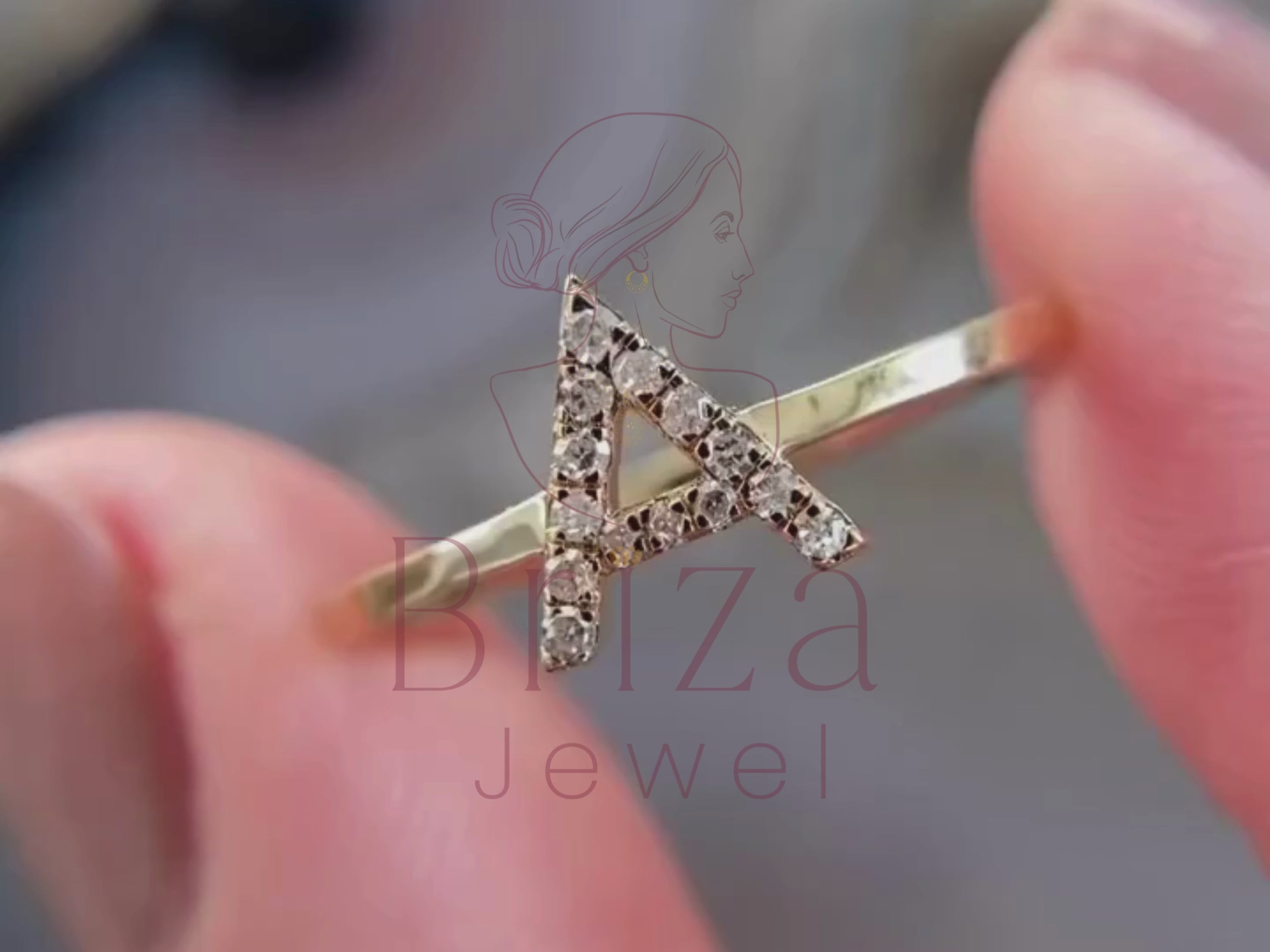 letter ring close-up showing moissanite initial detail
