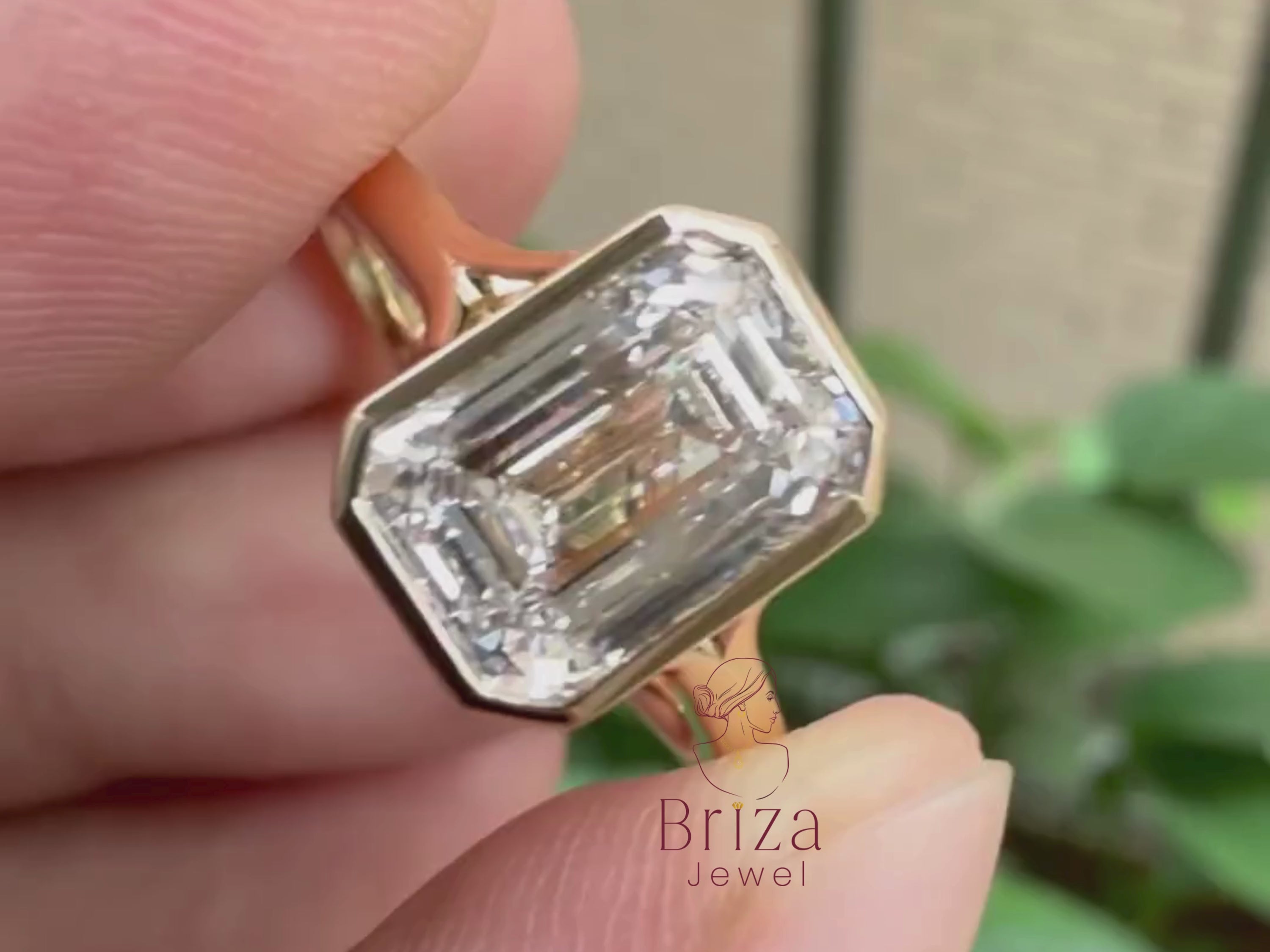 lab grown emerald cut diamond ring close-up showing geometric setting