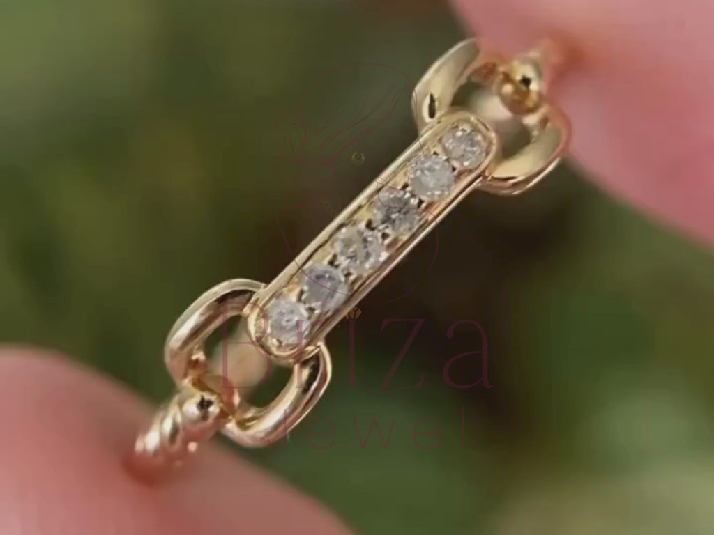 bold statement ring close-up showing delicate chain diamond detail