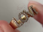 love diamond ring close-up showing pavé letter detail