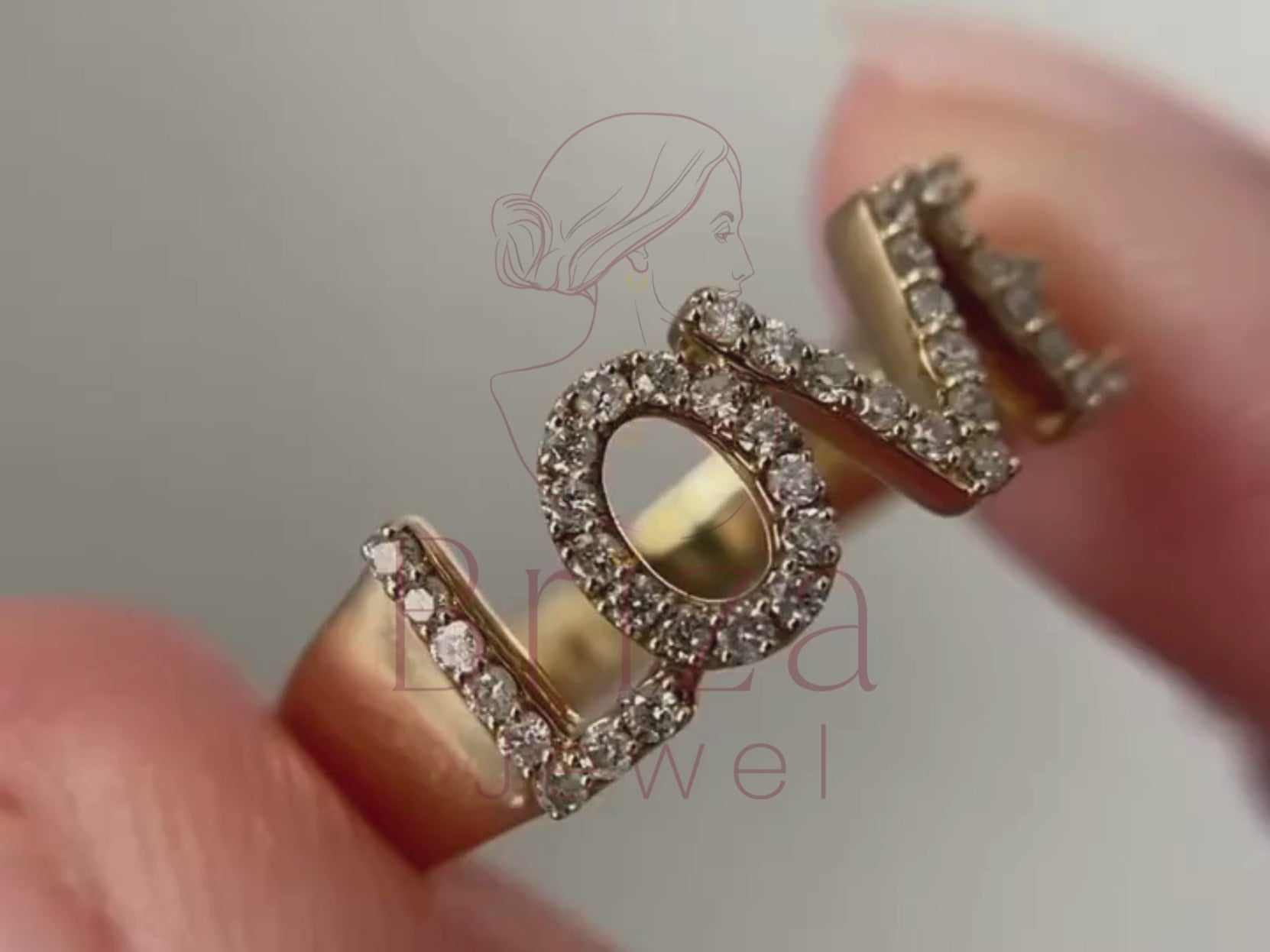 love diamond ring close-up showing pavé letter detail