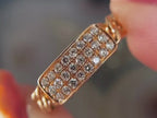 gold chain ring close-up showing pavé diamond links