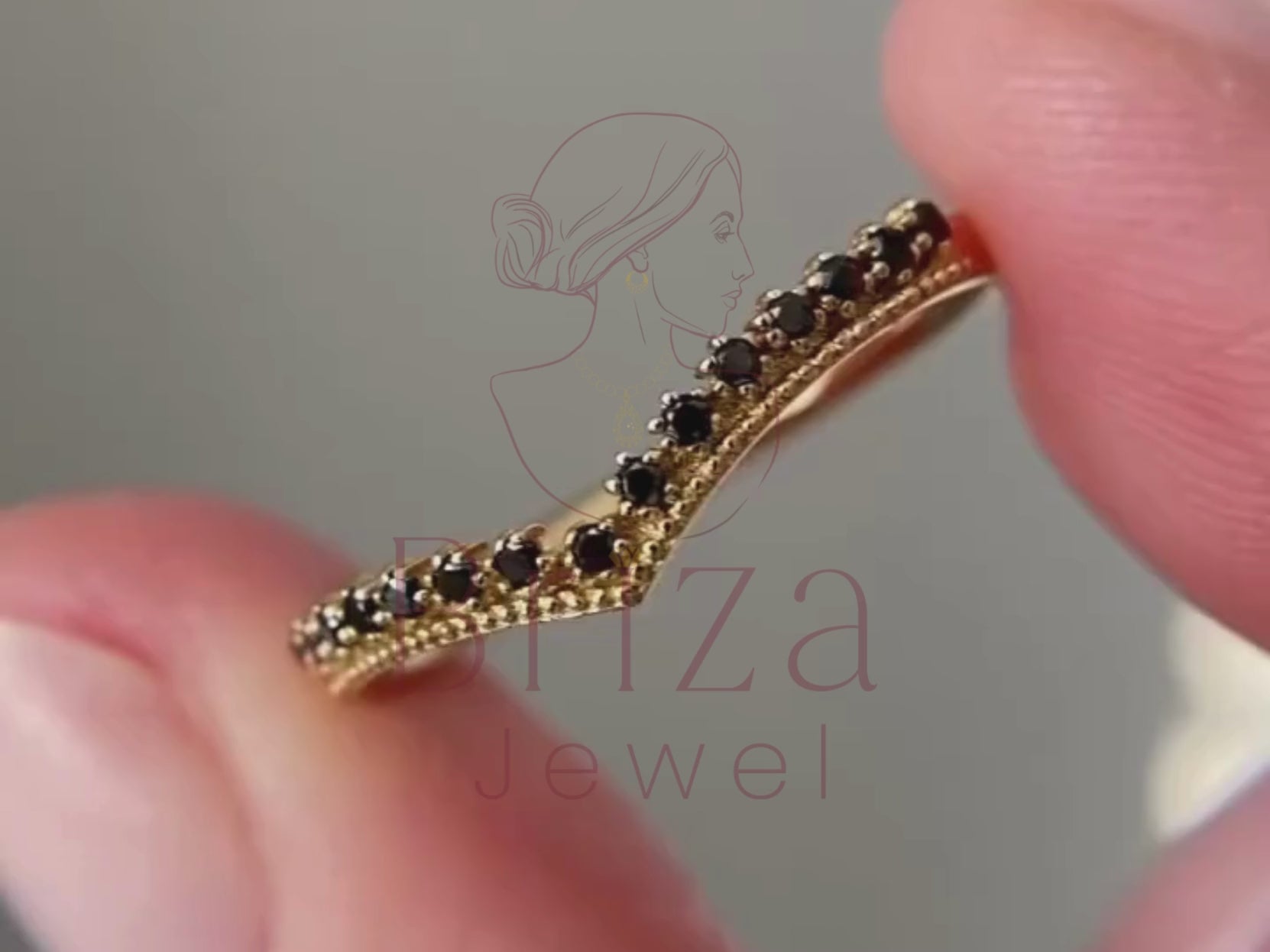 black moissanite ring close-up showing chevron V detailing