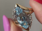 marquise engagement ring close-up showing blue moissanite detail