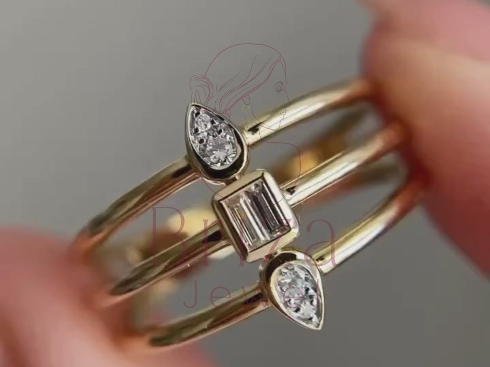 geometric wedding band close-up showing pear and baguette stone detail