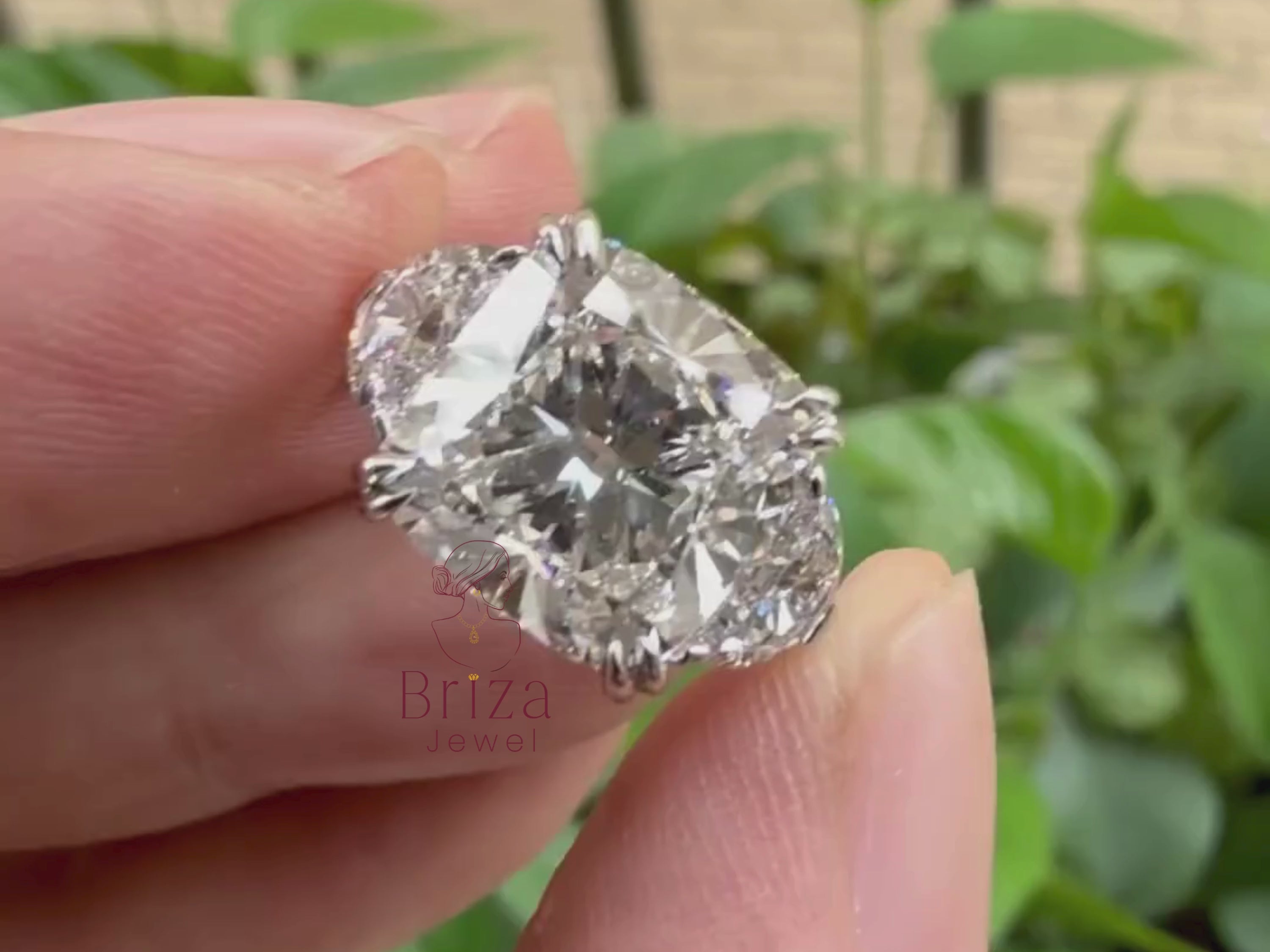 cushion cut lab grown diamond ring close-up showing side stone detail